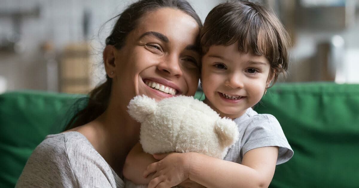 Mother and daughter smiling